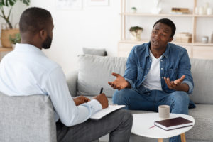 stressed out man during therapy session